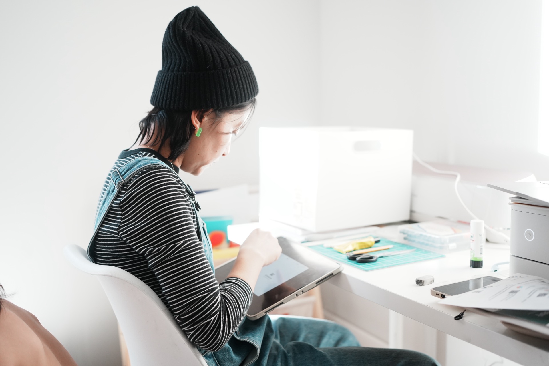 ljzhang drawing on a tablet at her desk