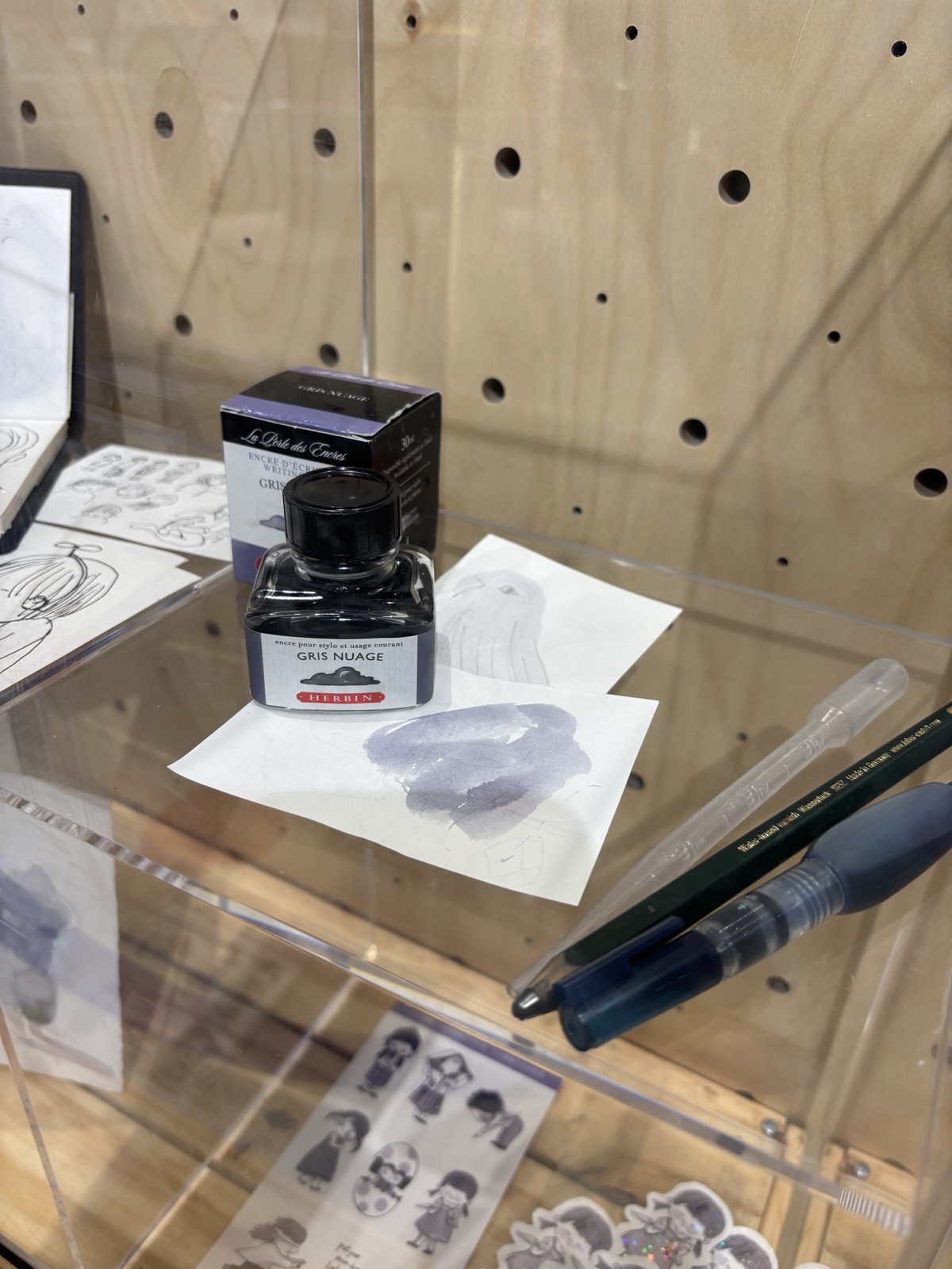 Ink and wash tests, in a display case