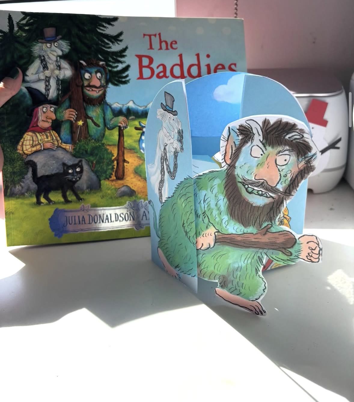 A fan pop-up card of the Zog character, made from The Baddies picture book, standing open on a desk